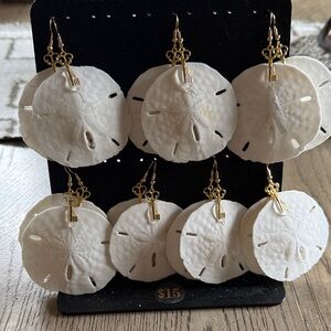 7 pairs of real sand-dollar earrings with gold tone key, hypoallergenic.